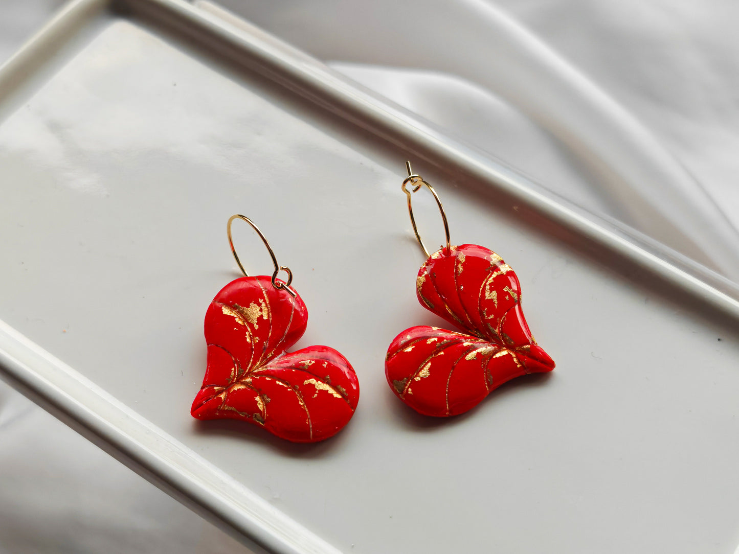 Red and gold heart leaf earrings