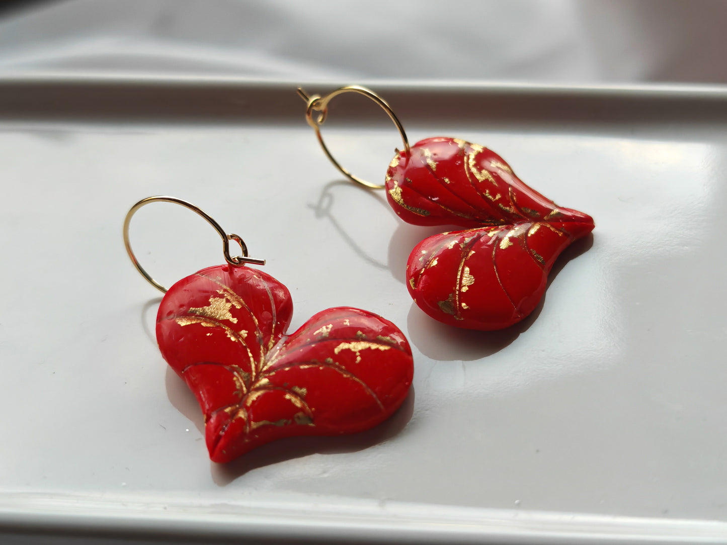 Red and gold heart leaf earrings
