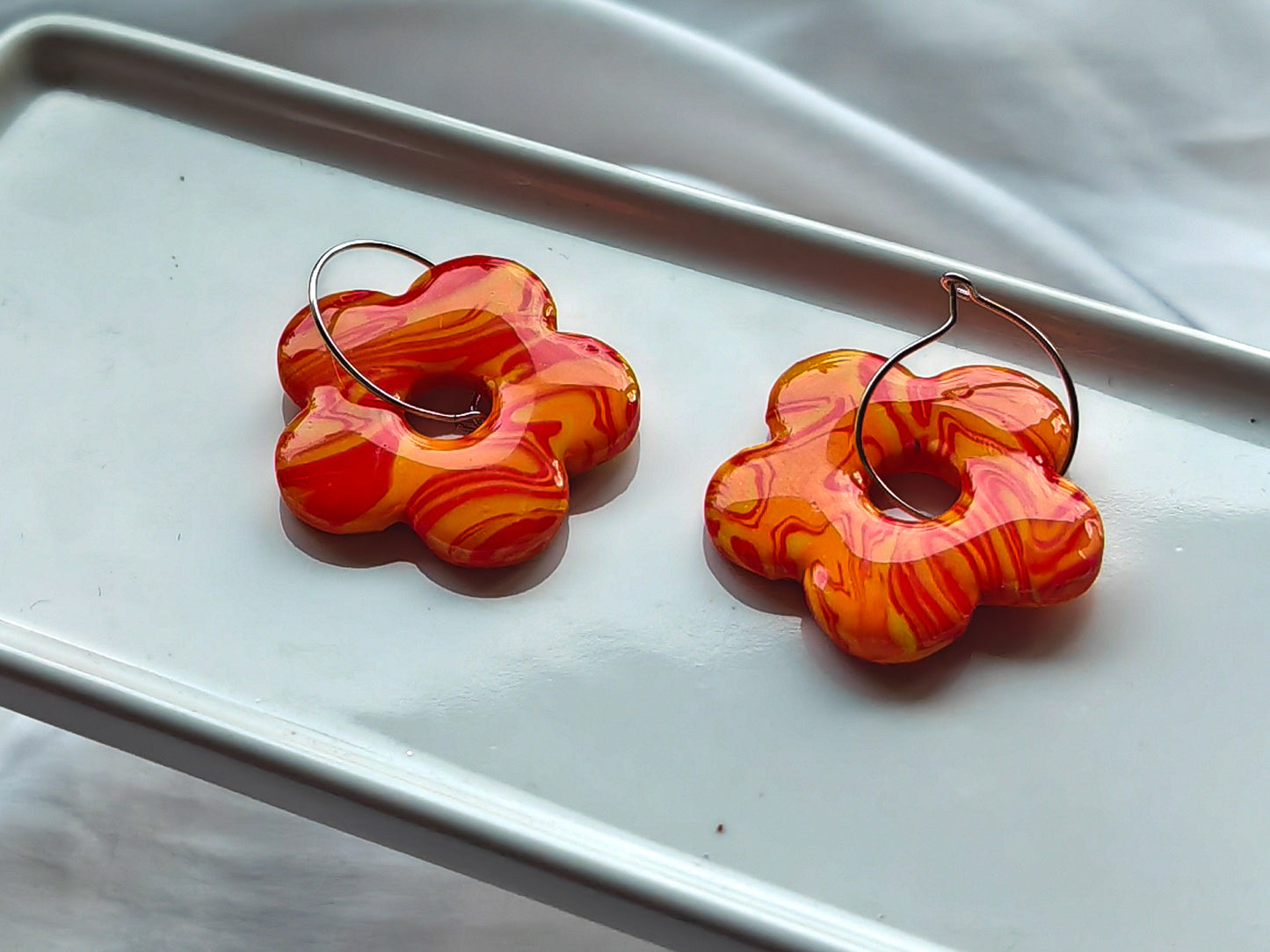 Orange flower hoop earrings