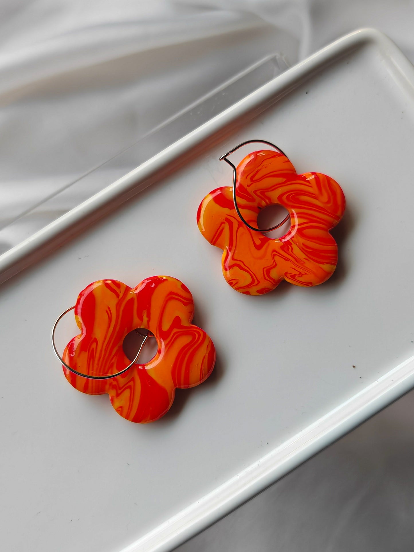 Orange flower hoop earrings