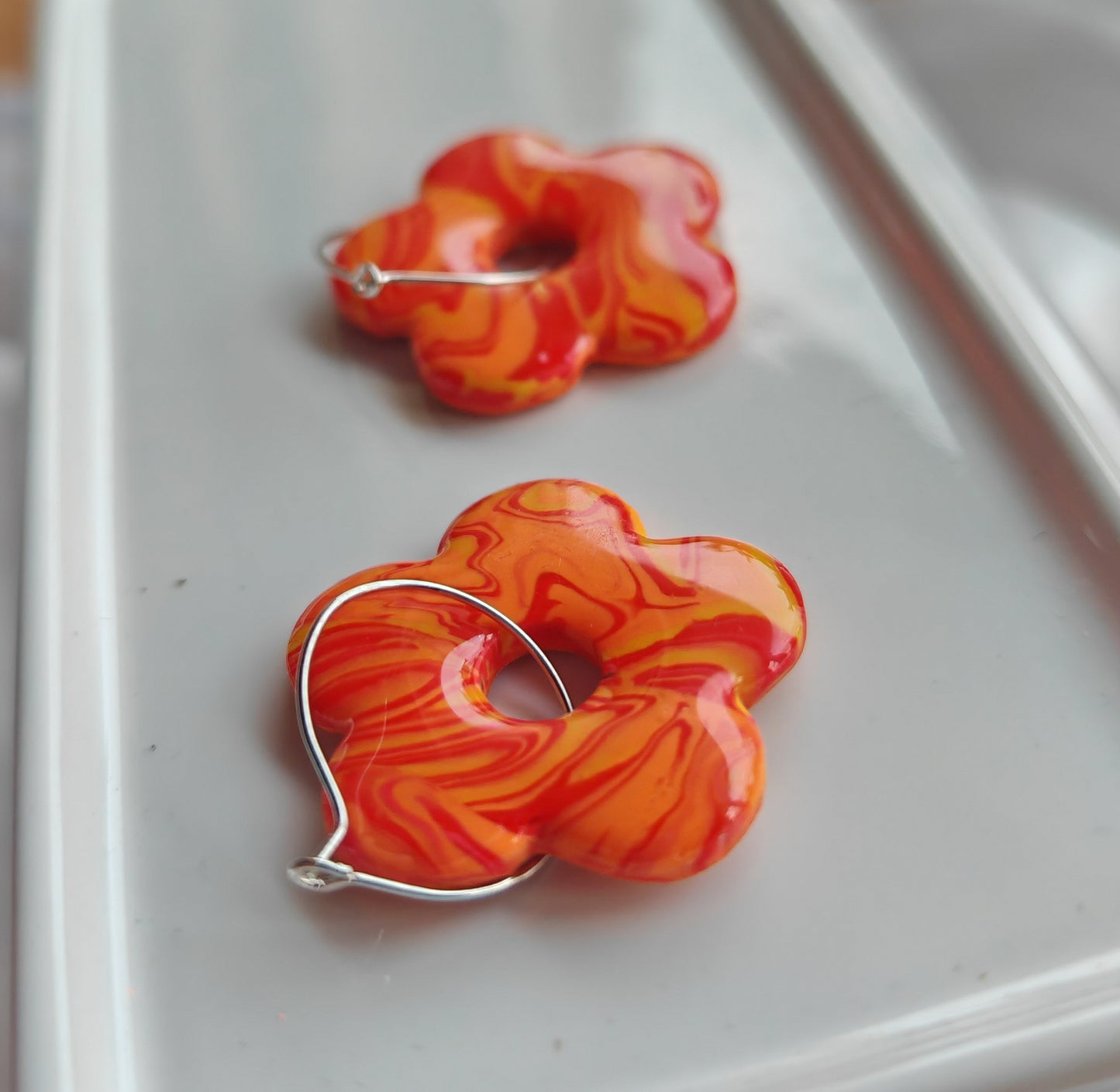 Orange flower hoop earrings