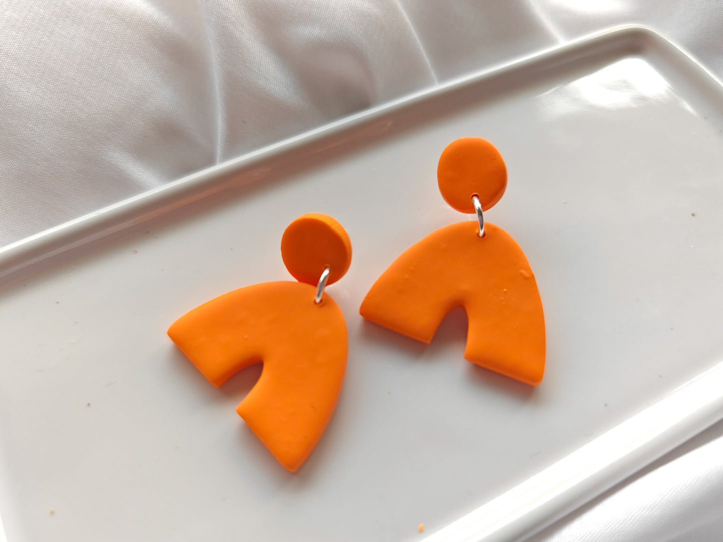 Orange arch earrings