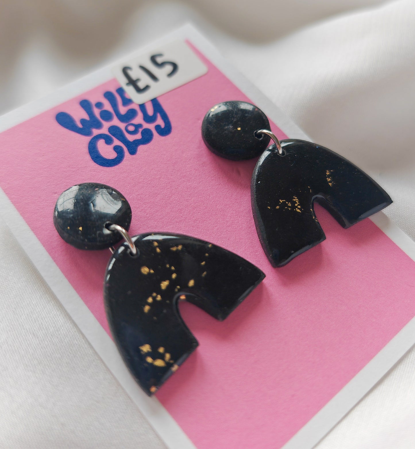 Gold flecked arch earrings