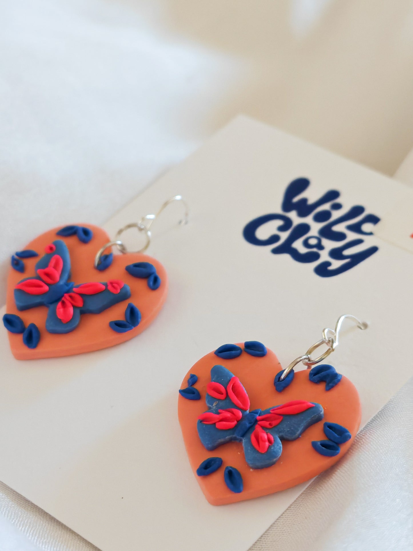 Butterfly heart earrings