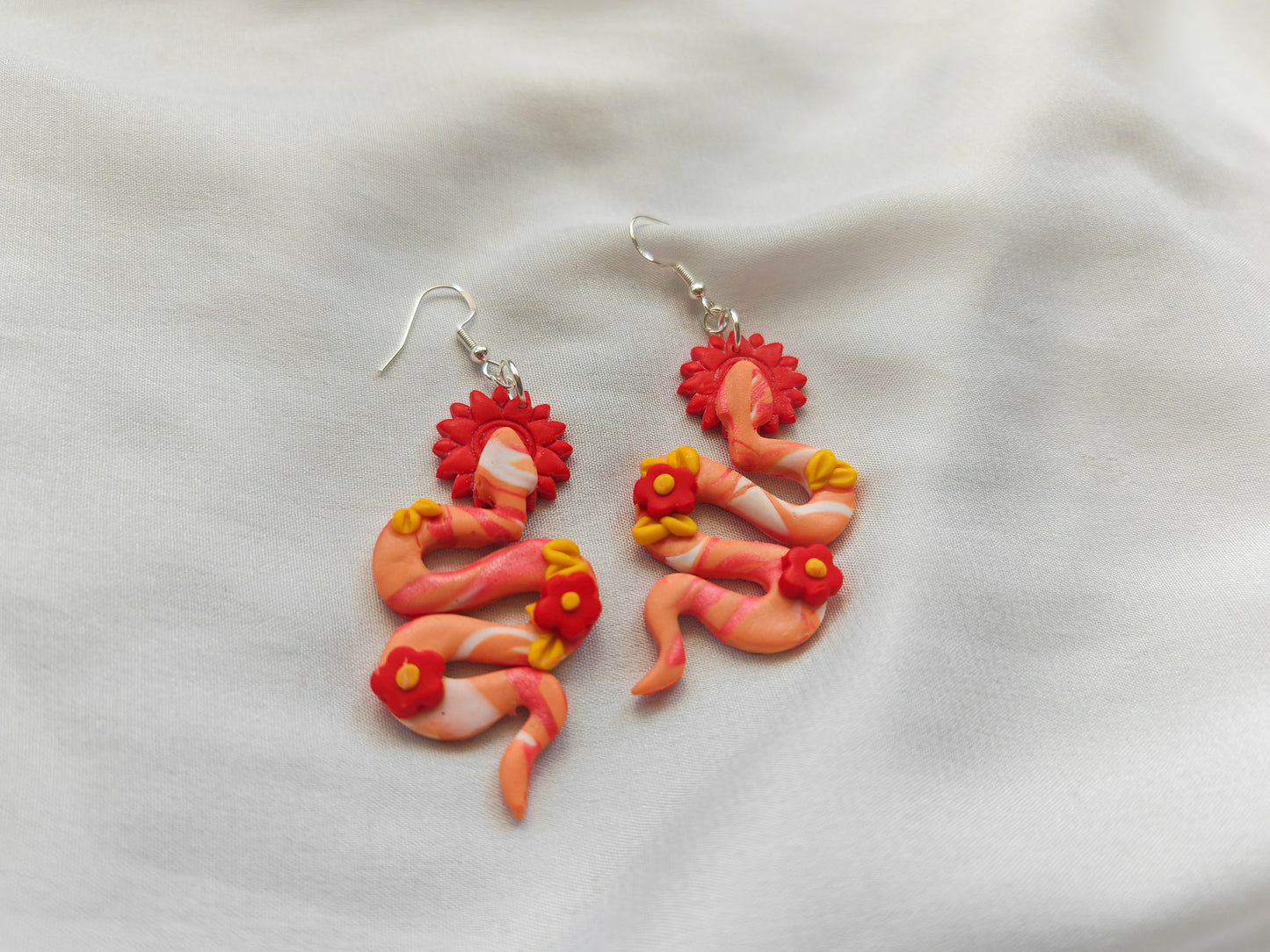 Red floral snake earrings