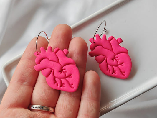 Hot pink anatomical heart earrings