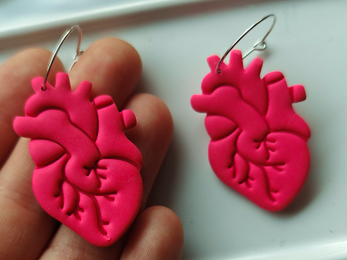 Hot pink anatomical heart earrings