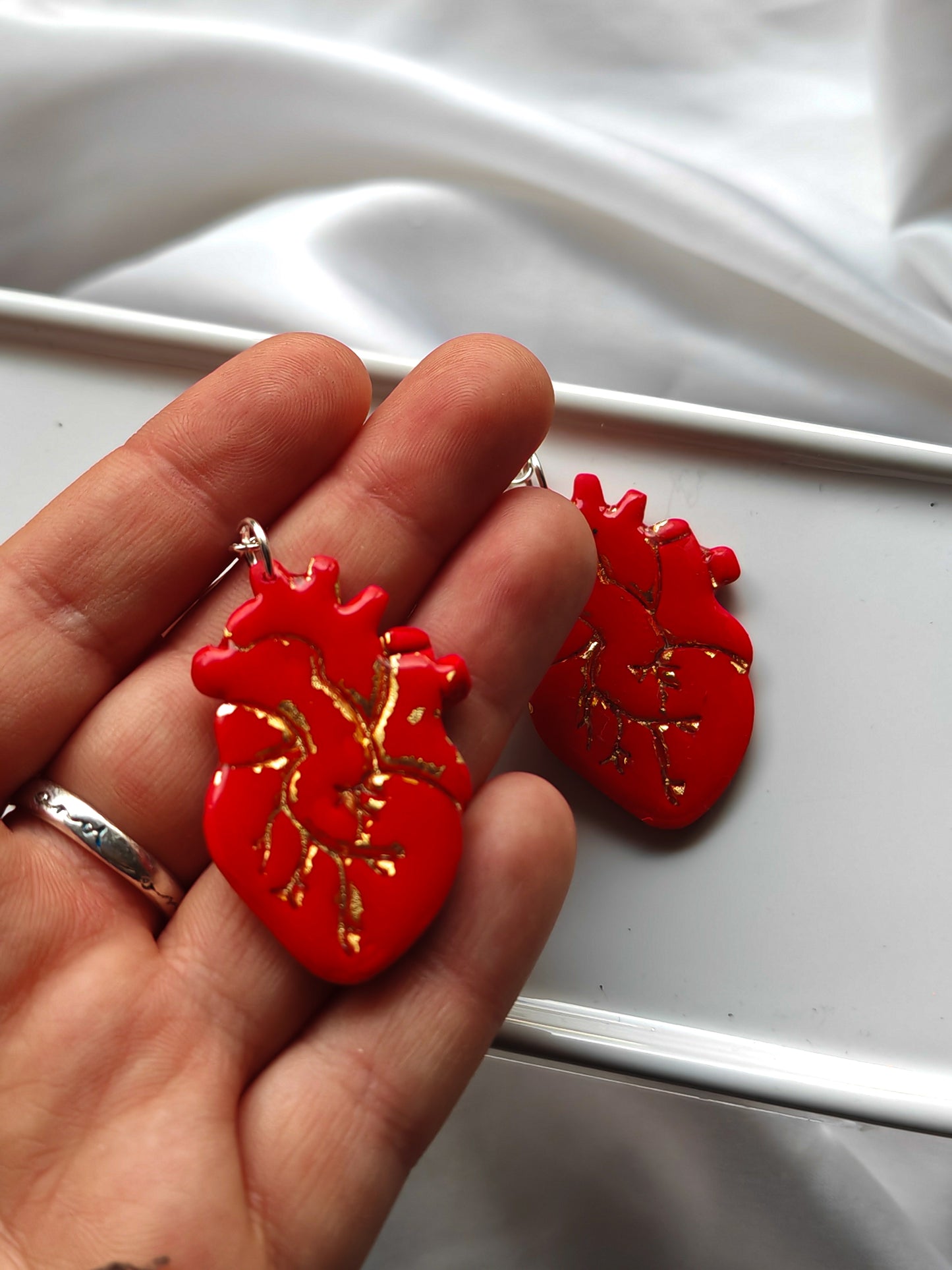 Red and gold anatomical heart earrings