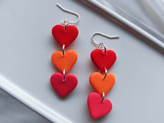 Pink, orange and red heart dangle earrings