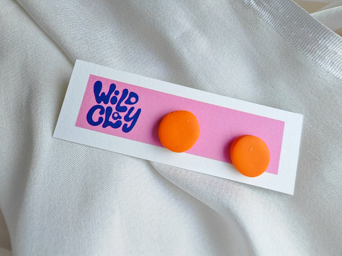 Orange circle studs