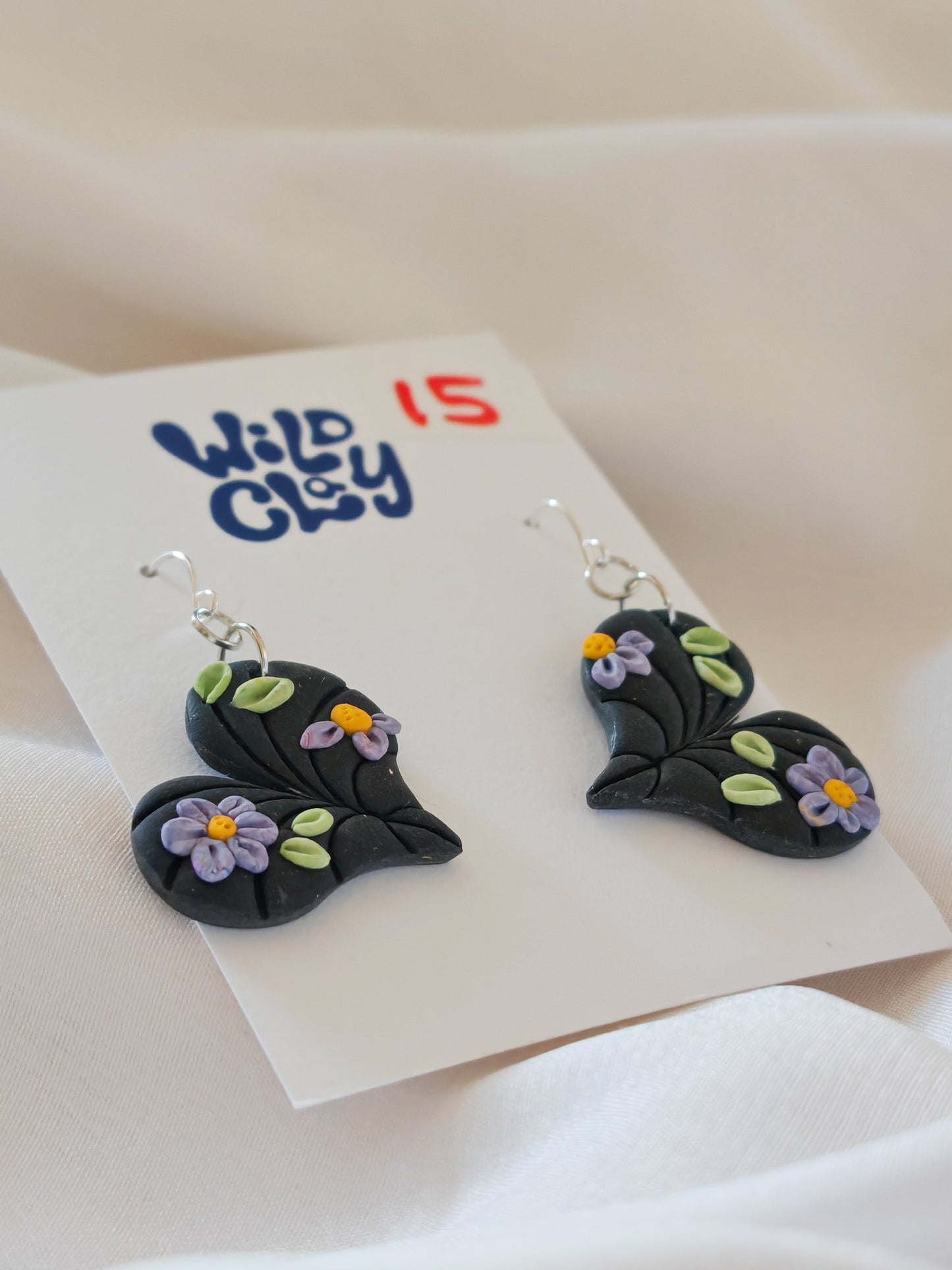 Black heart shaped leaf earrings